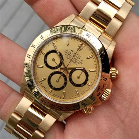 rolex daytona gold chronograph.